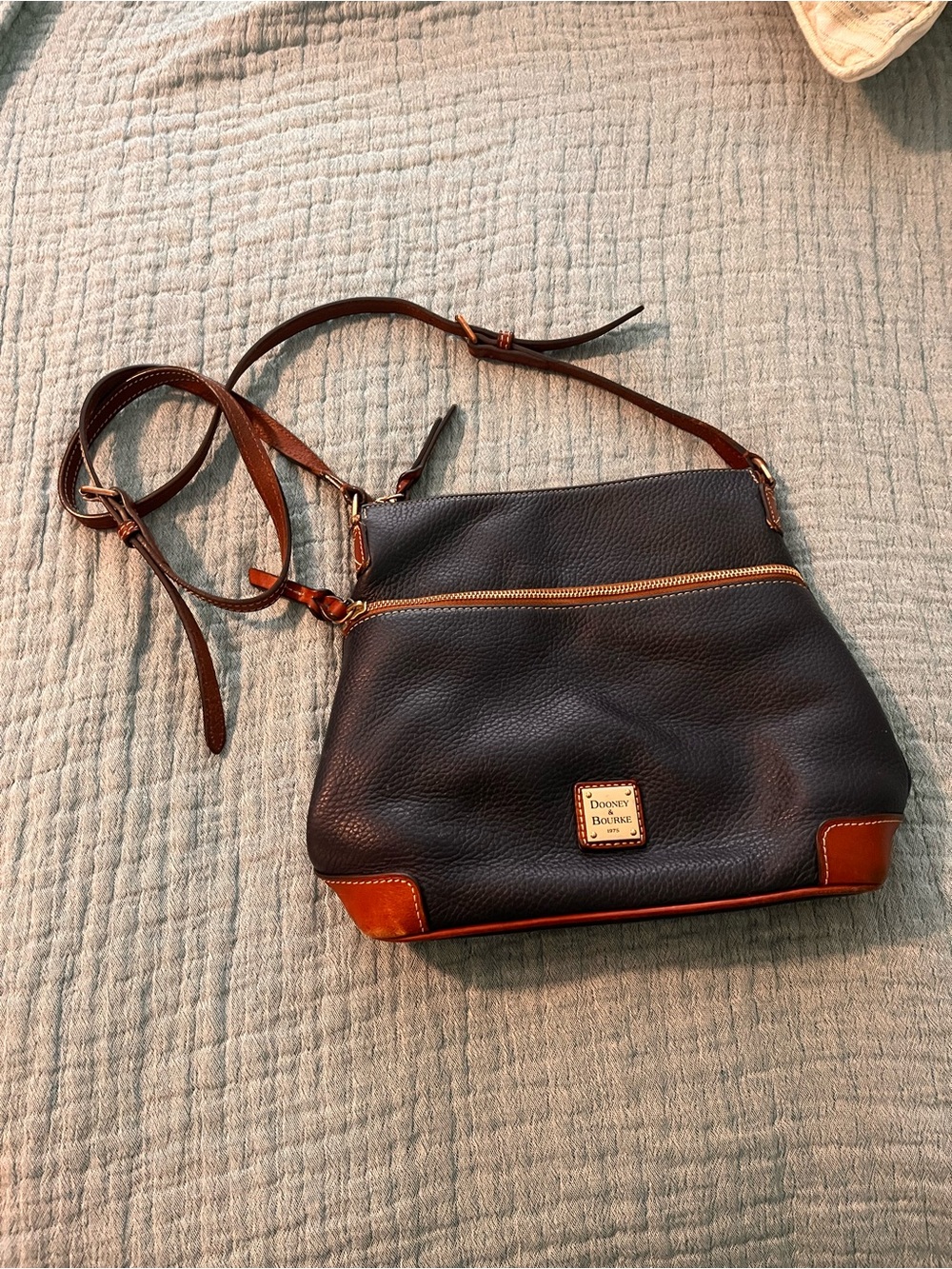 Dooney & Bourke dark blue Pebbled Leather Crossbody with Brown Trim